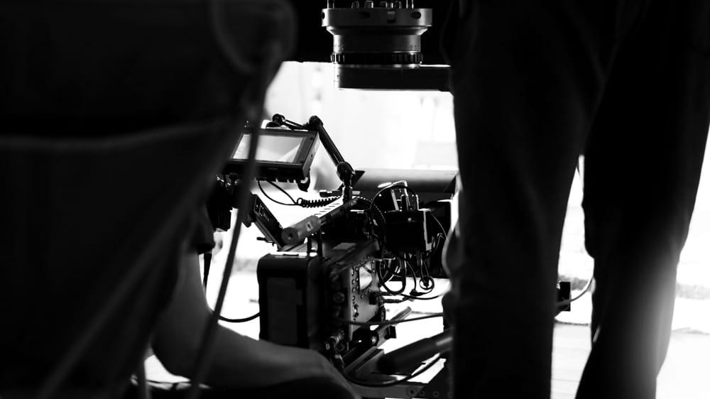 A cameraperson using an Arri Camera