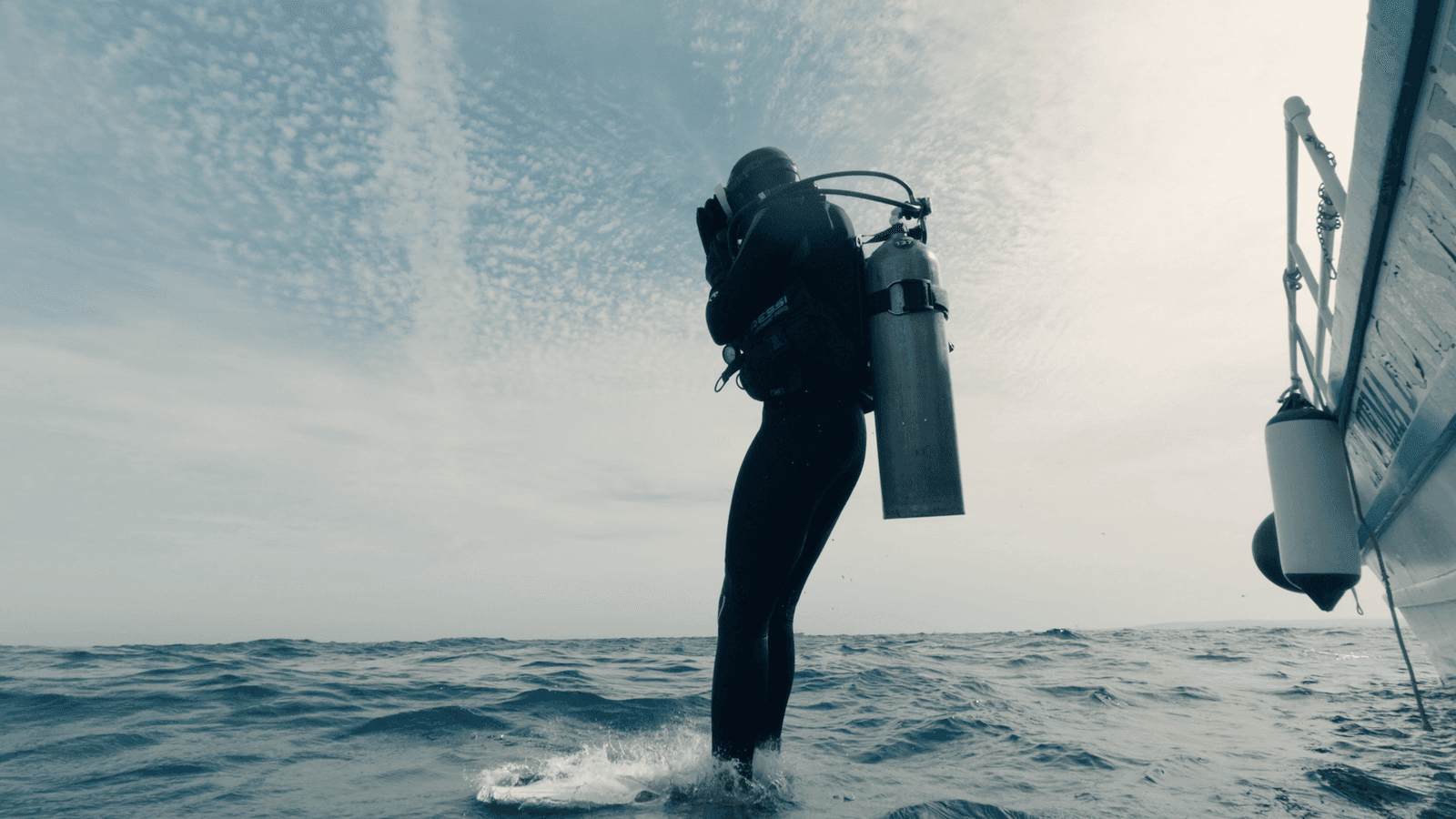 A shot from a commercial filmed for APS Bank, showing a diver jumping in the water.