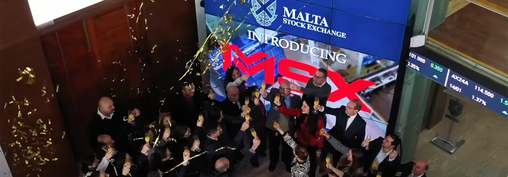 image shows a celebration at the Malta Stock Exchange